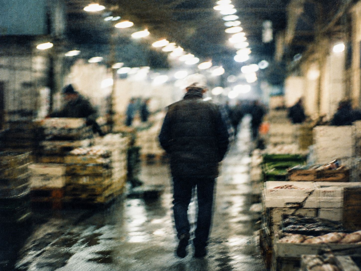 A fish market on the night shift, under hard overhead light